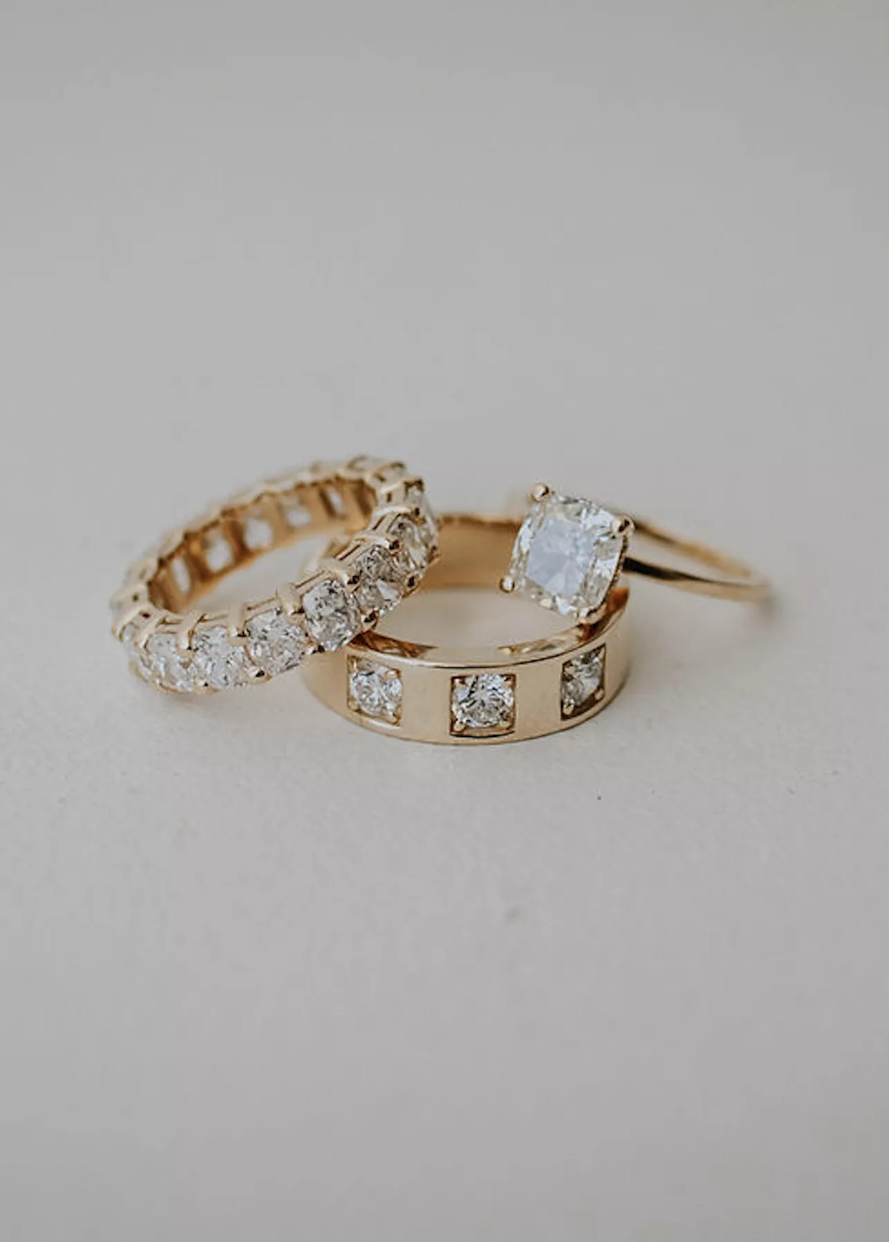 three gold diamond wedding rings