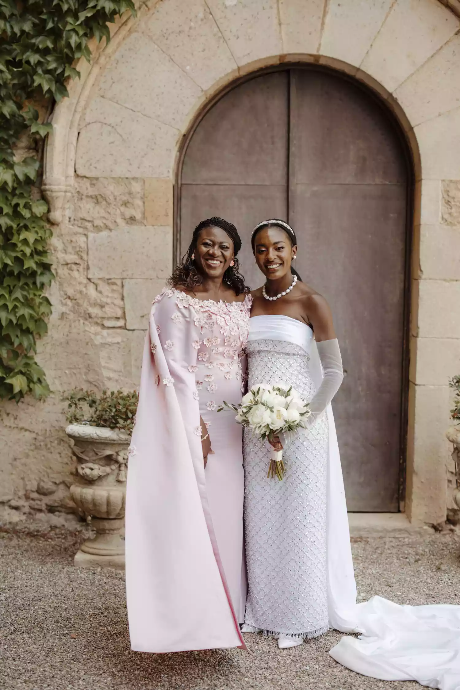 bride and her mom posing for wedding portraits