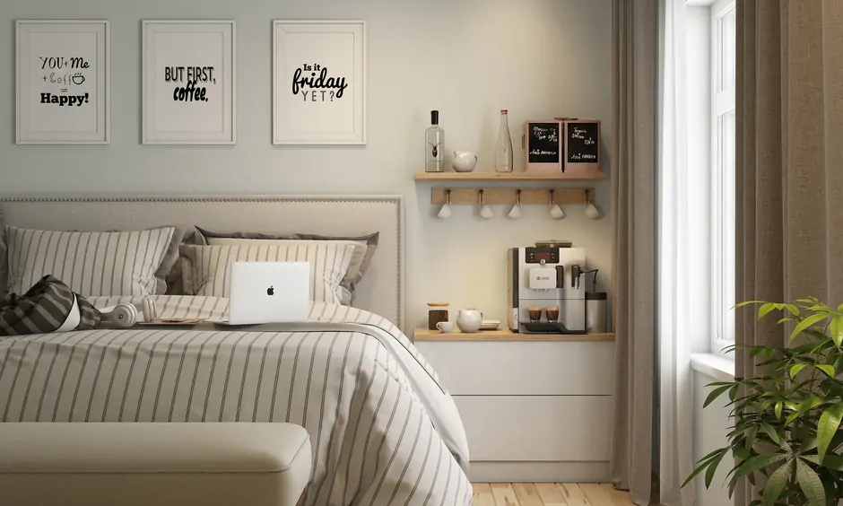 Bedside table is decorated with a coffee machine and a wall-mounted floating cup shelf