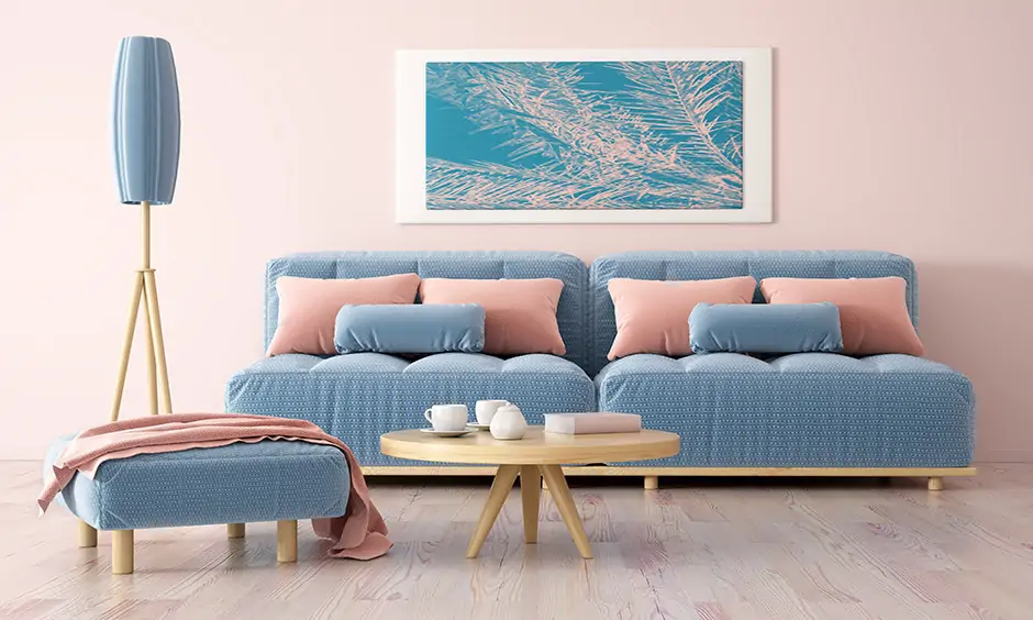 Soothing blue tones beautifully complement the rosy-peach colour combination for the living room