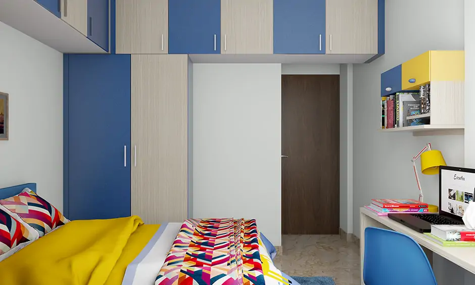 Colorful kids wardrobe designs with a vibrant combination of blue & white with the overhead cabinet are gorgeous.