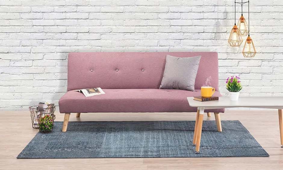 A compact and versatile sofa bed is ideal for a 1 bhk apartment that doesn't have much space