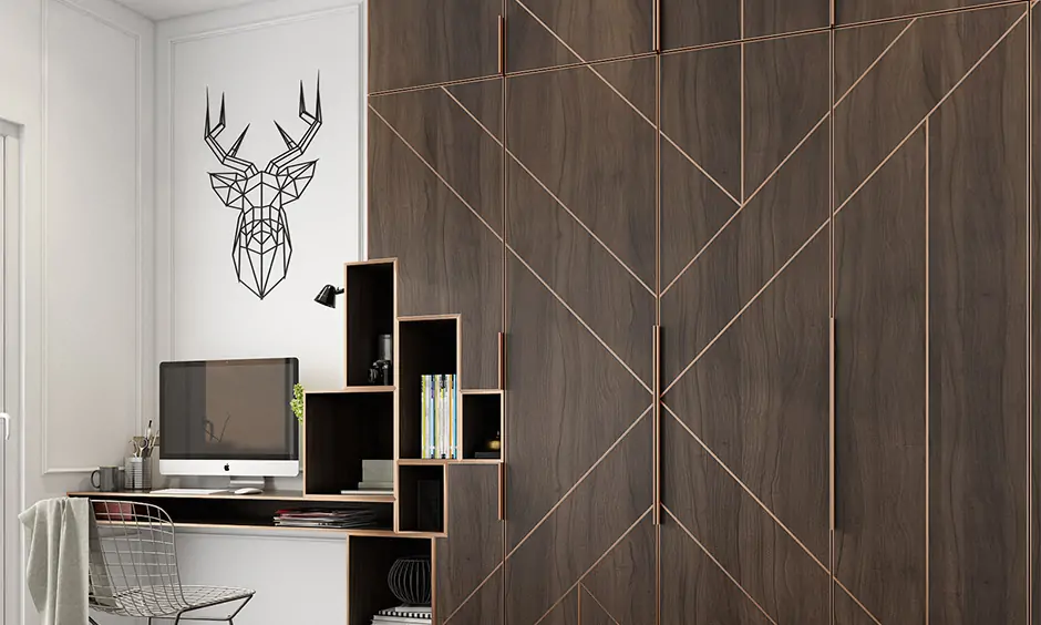 Wall-mounted study table at the corner next to a wardrobe with storage looks sleek and straightforward.