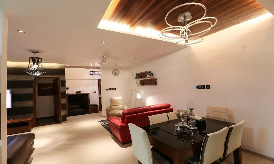 Living room cum dining hall false ceiling design with lights is the latest design and grants a majestic look.