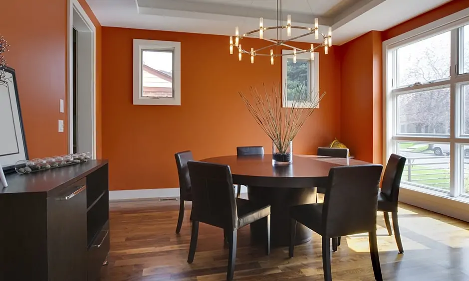 Dining room wall painting with a pop of orange