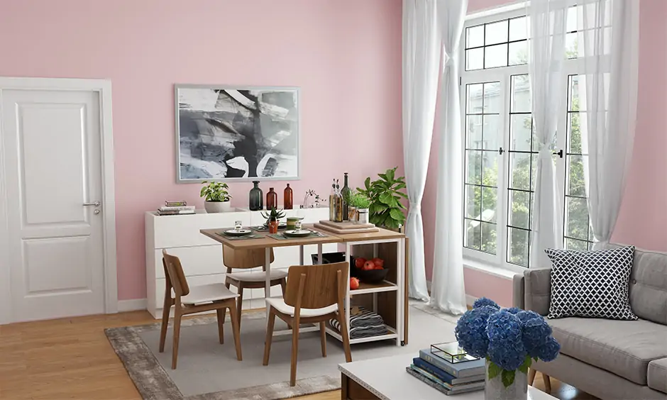 Dining room with playful paint colors in pink and white perfectly complements the dining setup