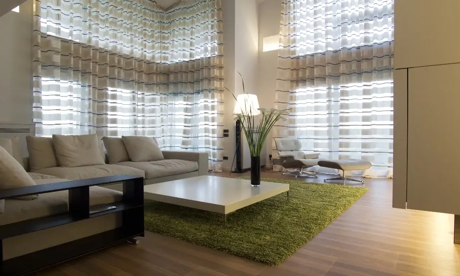 This living room has ceiling-to-floor drapes are the stunning modern curtains for grey living room.