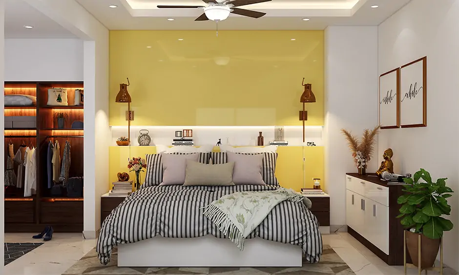 Ivory wall paint paired with a yellow acrylic sheet in the bedroom creates a modern touch