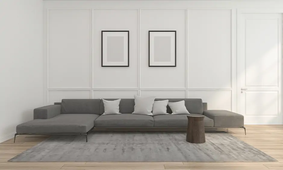Low height living room l shape sofa set designed with extra-wide cushions look minimal and classy.
