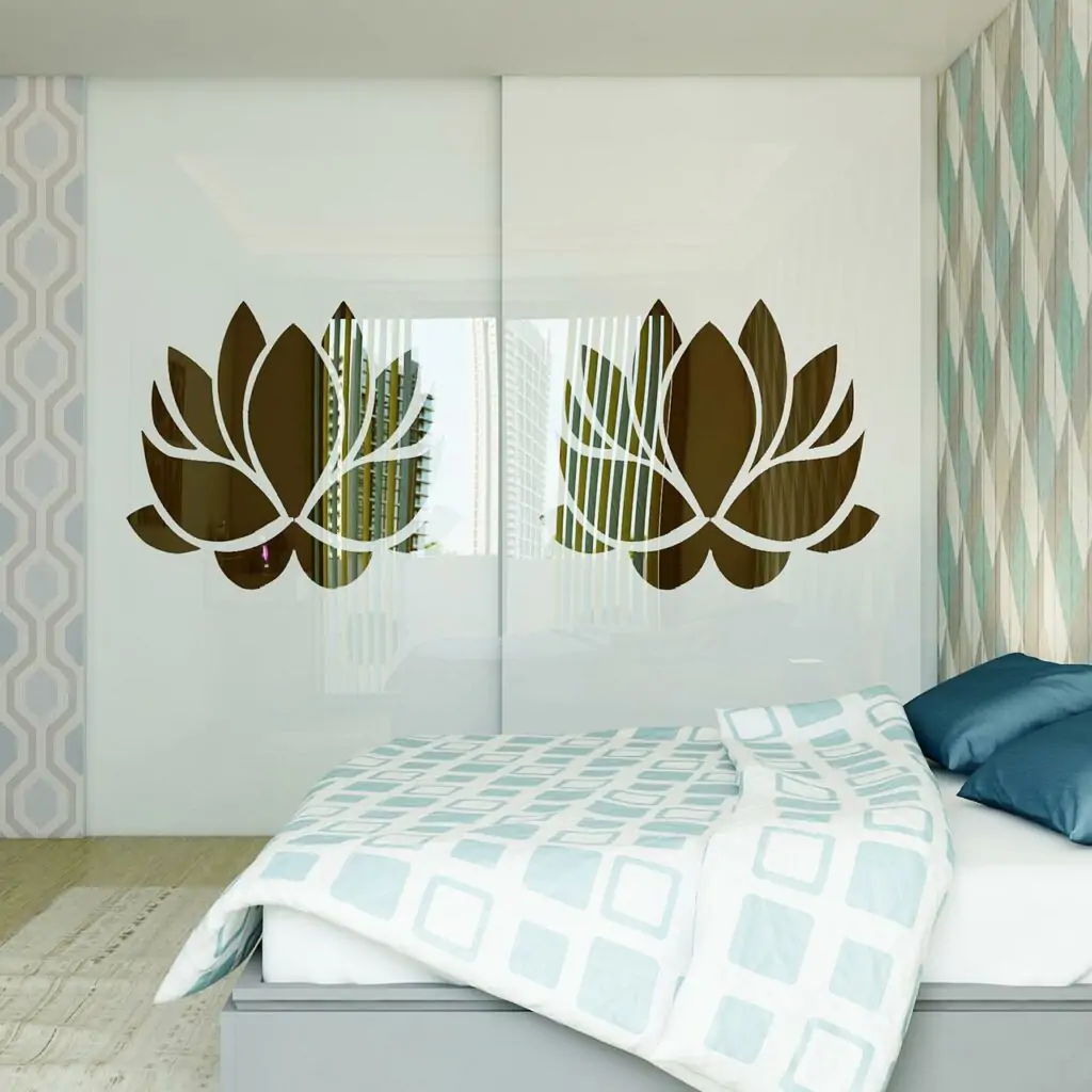 Modern sliding wardrobes has patterned wallpaper, styled wardrobe sliding doors and geometric bedspread