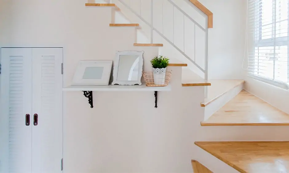 Simple staircase wall decor with open shelf