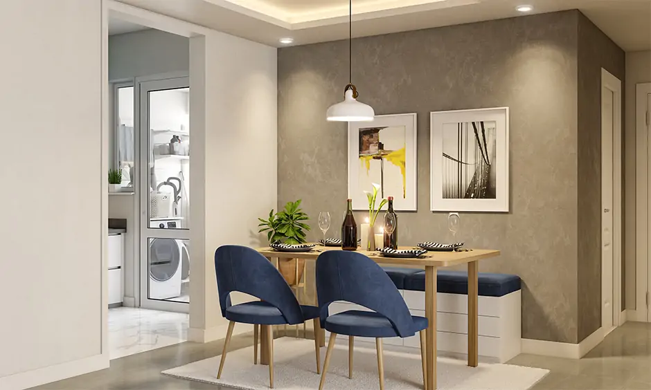 Blue chairs and dining table against light grey walls in dining room