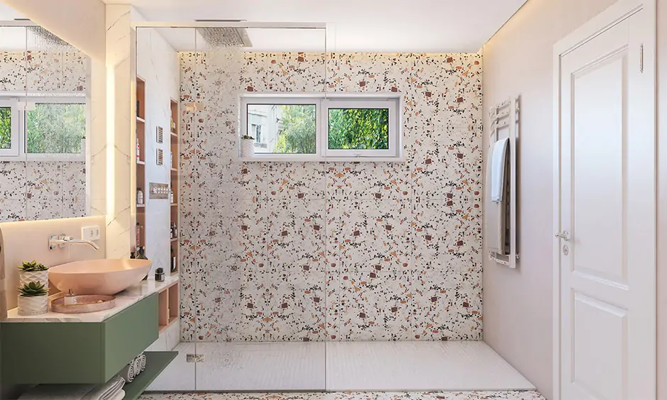 Beige-brown terrazzo tiles on the bathroom floor and walls look soft, silky, and smooth
