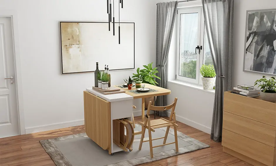 Foldable dining table with chairs with storage space accentuated by the natural light