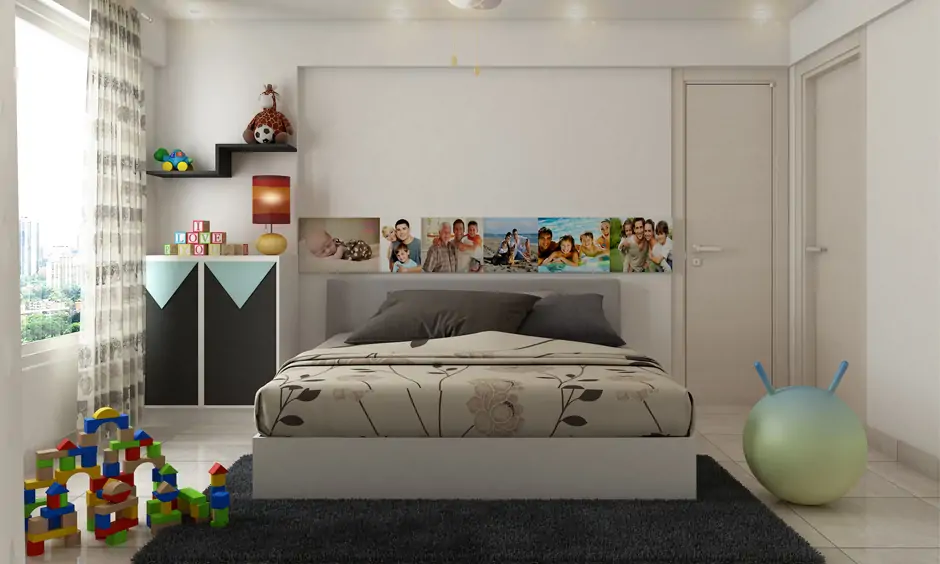 Kid’s room decor items, a colourful fan, and a photo decal behind the bed add a playful charm