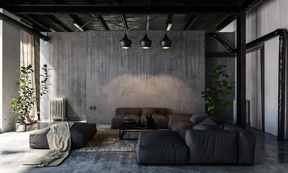 Living room in dark shades of wall colour combination with black furniture lends an industrial look