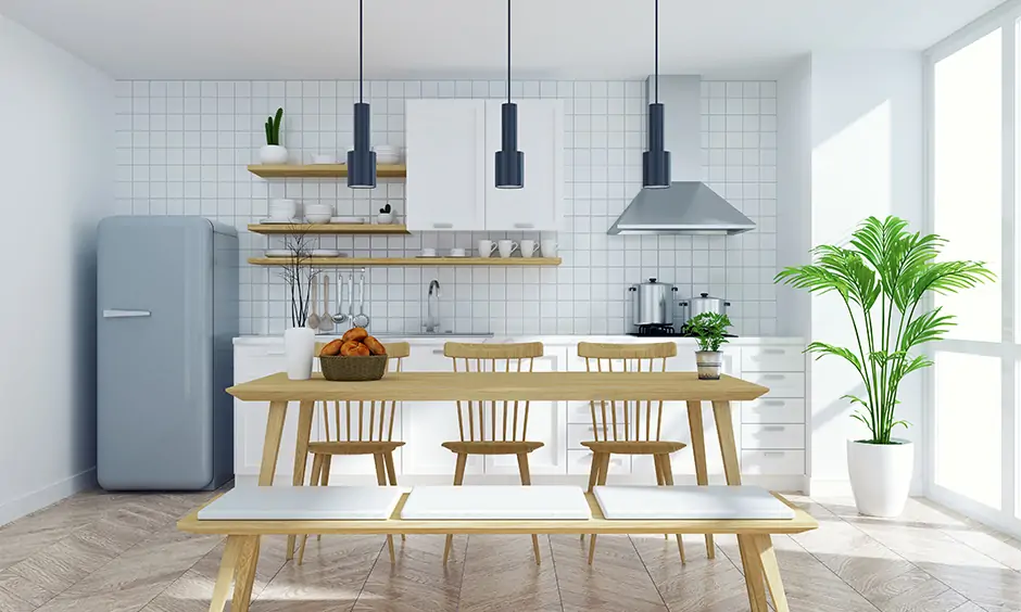 Kitchen interior design with a dining table in bench style and white tiles wall gives you a picnic vibe.