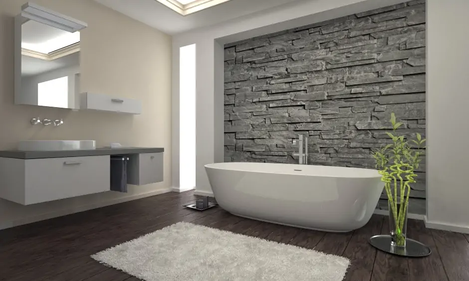 Minimalistic modern bathroom with an artificial stone wall cladding elevates the look of the space