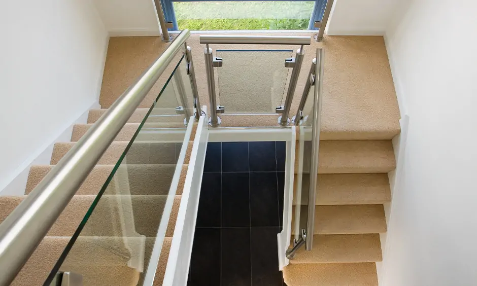 Contemporary stainless steel staircase railing designs in india strikes a perfect balance of form and function