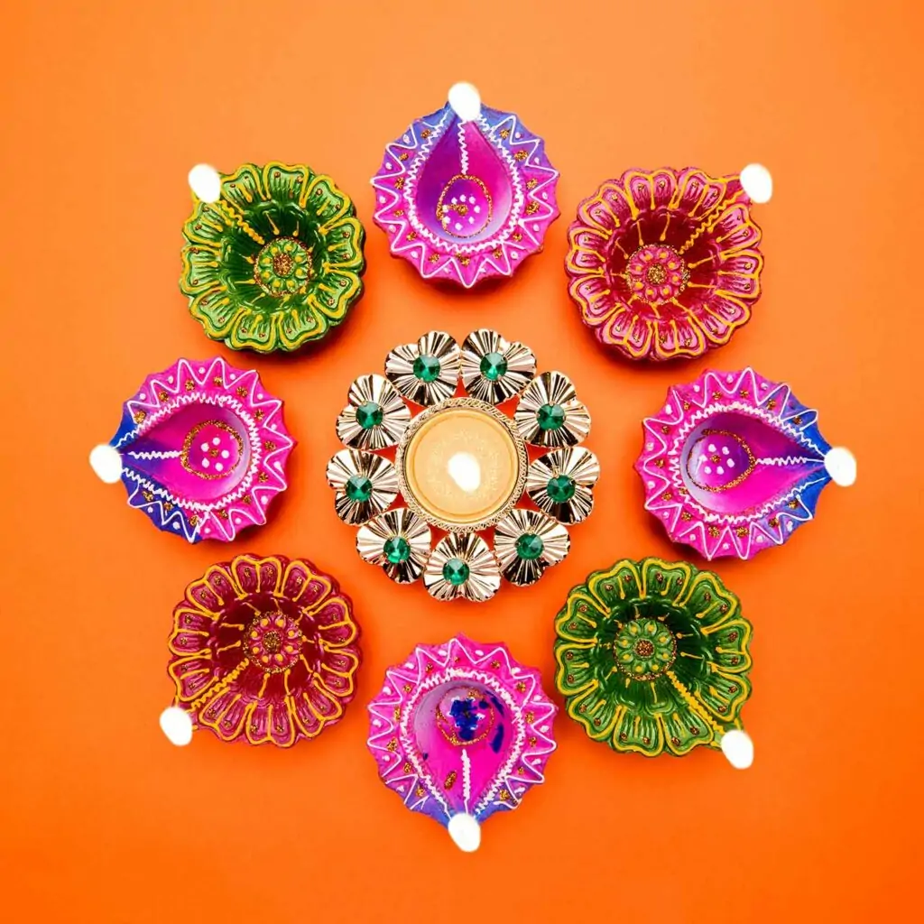 Paint your diyas with different patterns and colours for a colourful diy look