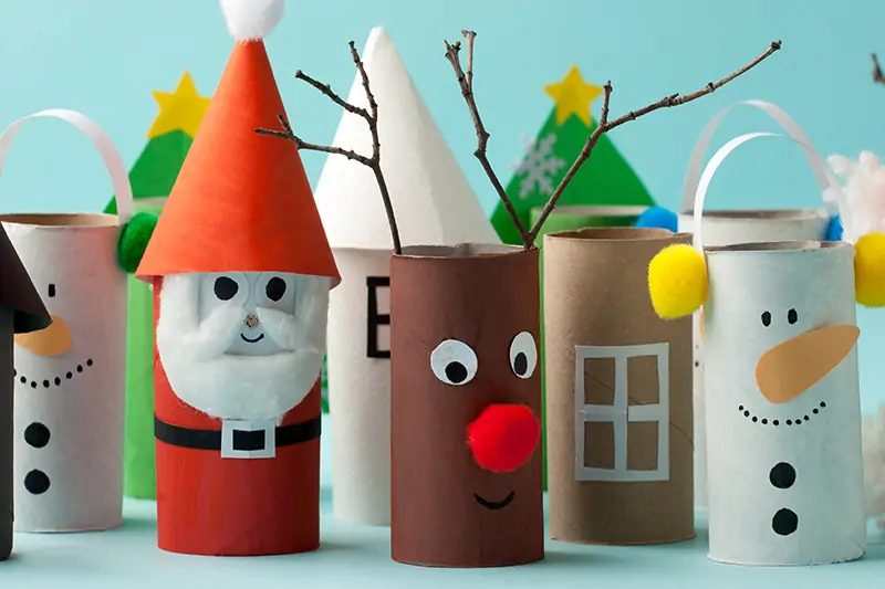 Diy christmas decoration with origami paper cardboard rolls and paint