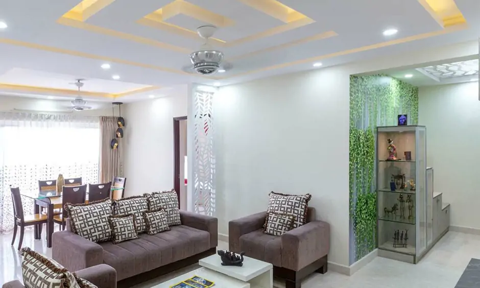 Gypsum false ceiling in a spiral shape with recessed lighting enhances its intricate beauty