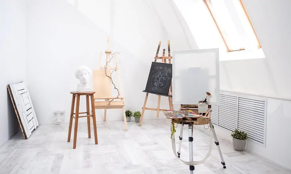 Home art studio design in attic with lots of natural light perfect for art studio