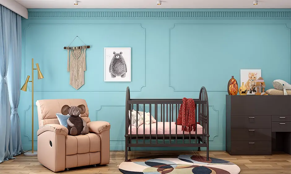 Modern nursery design a deep wooden cot with soft bedding and a storage cabinet accentuate the look