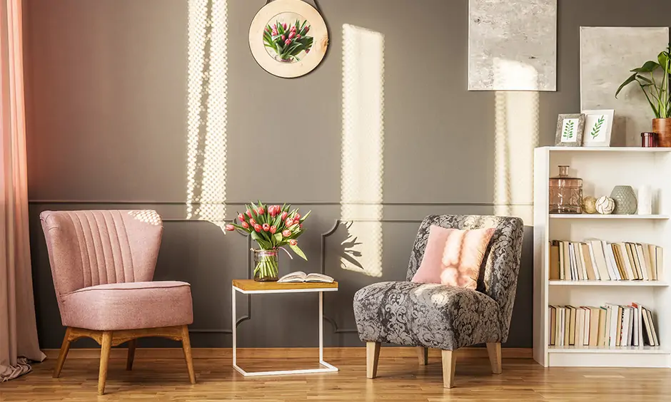 Modern reading room design with a simple white wood bookshelf and harmless chairs creates a sophisticated vibe