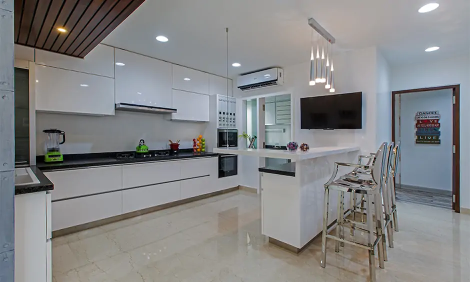 Modular furniture kitchen with a breakfast counter designed in bengaluru
