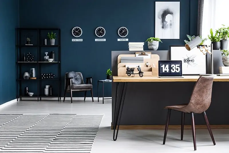 Navy blue paint colors create a sense of visual drama in your home office