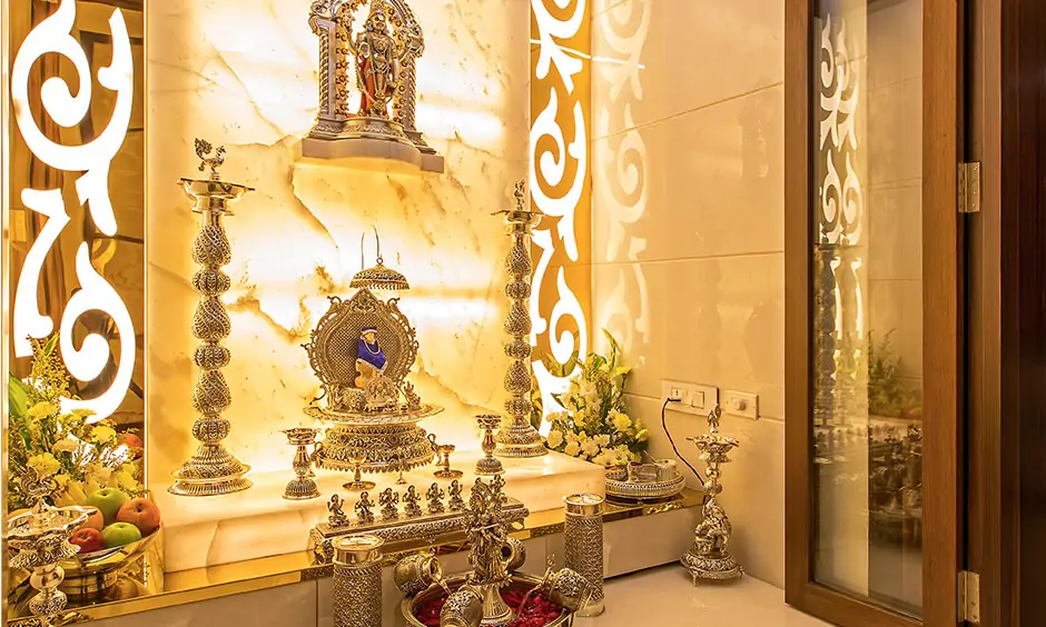 Plain pooja room glass door design which lights up space with its abundant gush of light.