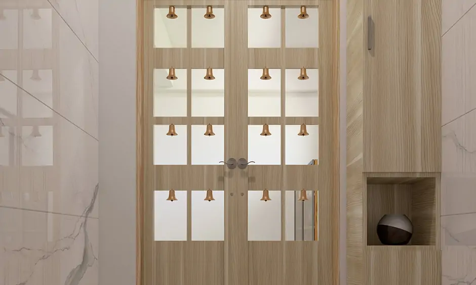 Simple glass pooja room door design which is functional and aesthetic