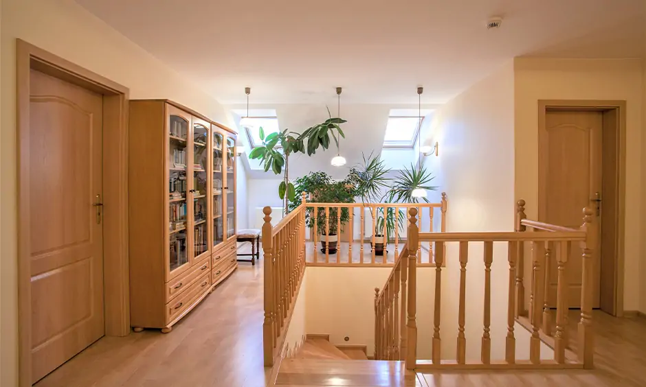 Staircase wooden handrail design in light brown turned wood spindle