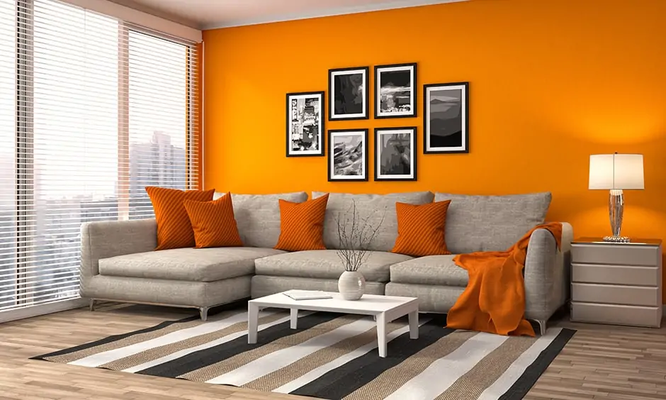 Warm color scheme with a bold orange wall brings in warmth