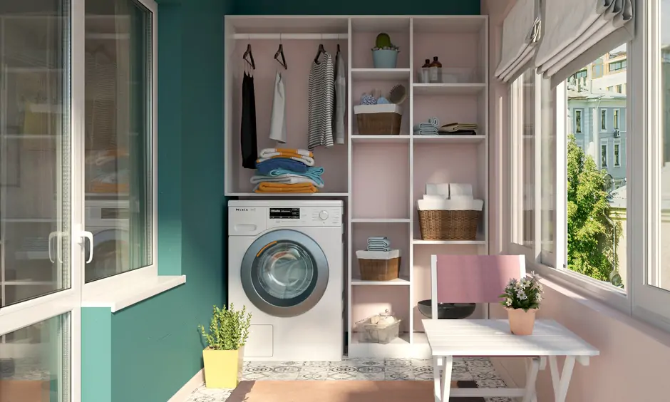 Washing machine sits below open storage in a pink and teal wash area design in India