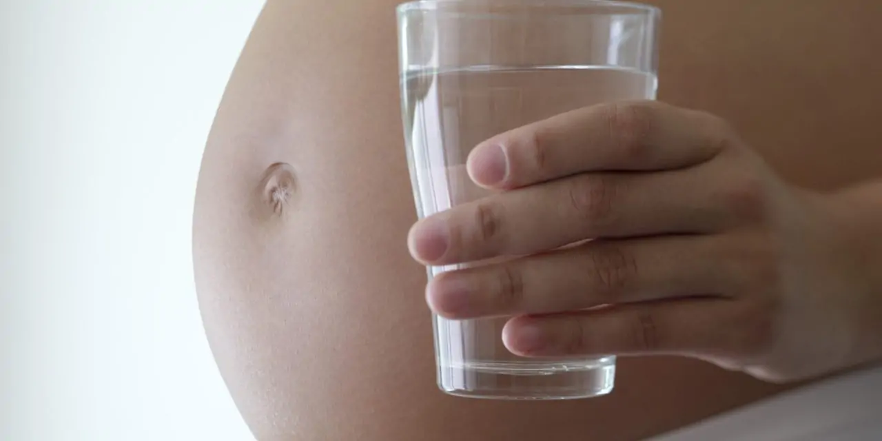 Pregnant woman drinking water